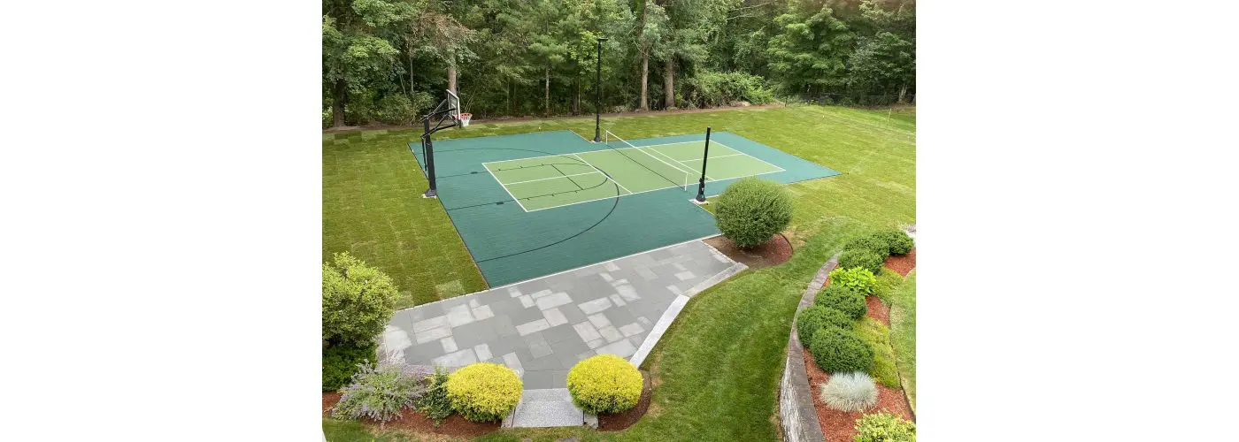 Image of backyard basketball court and pickleball court with nice landscape