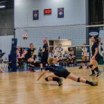 Female teams playing volleyball