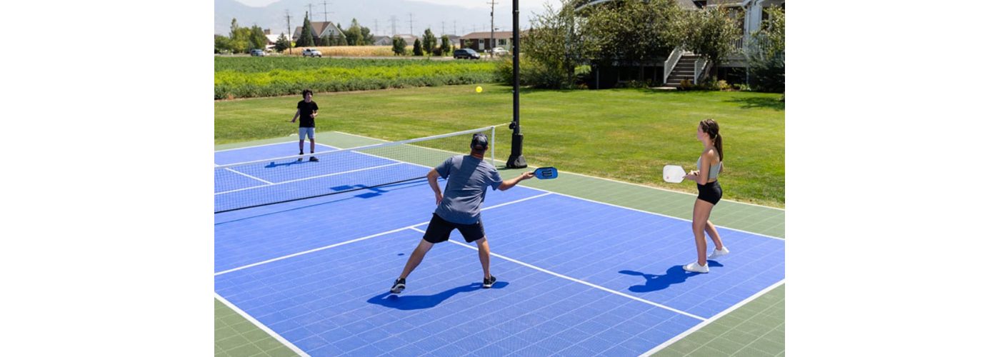 Father and son playing pickleball