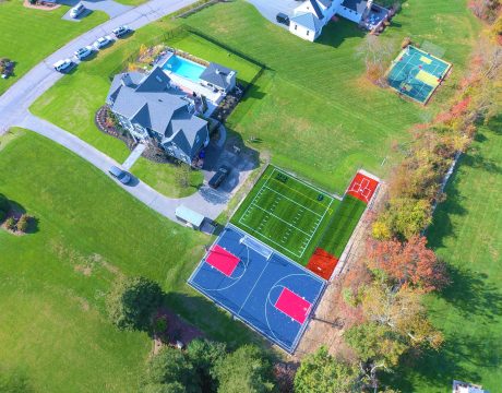 image of batting cage, turf field, and basketball court